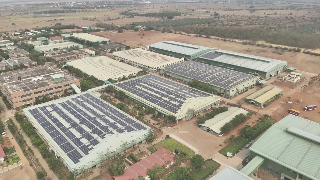 A top-down aerial photo showing land, buildings, and roads from high in the sky.