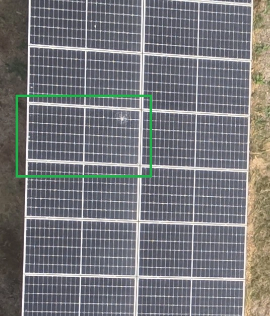 Solar panel with visible cracks and surface damage, showing signs of wear and reduced efficiency
