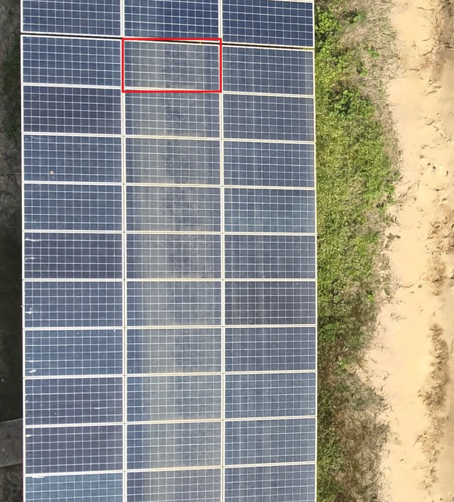 Solar panel with visible dust layer reducing sunlight exposure, emphasizing the need for cleaning and maintenance.