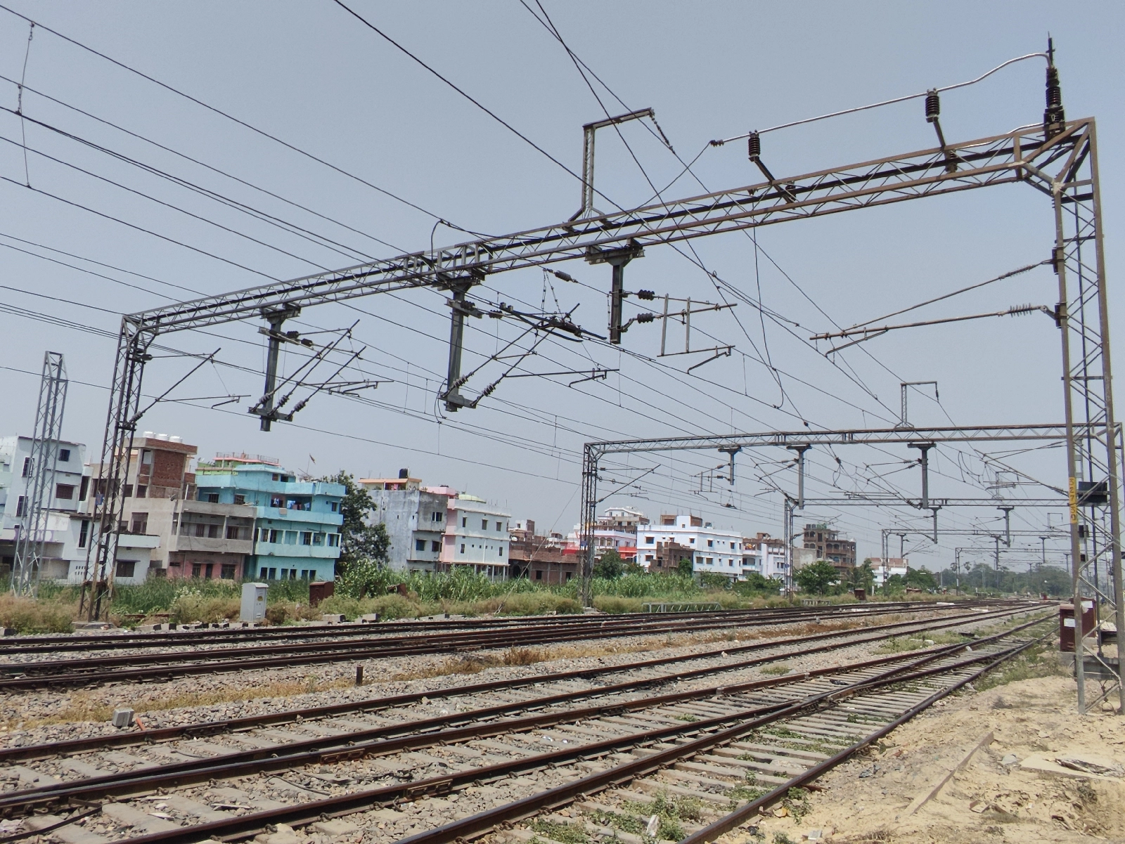 Technician inspecting overhead electrical or mechanical equipment for safety and maintenance.