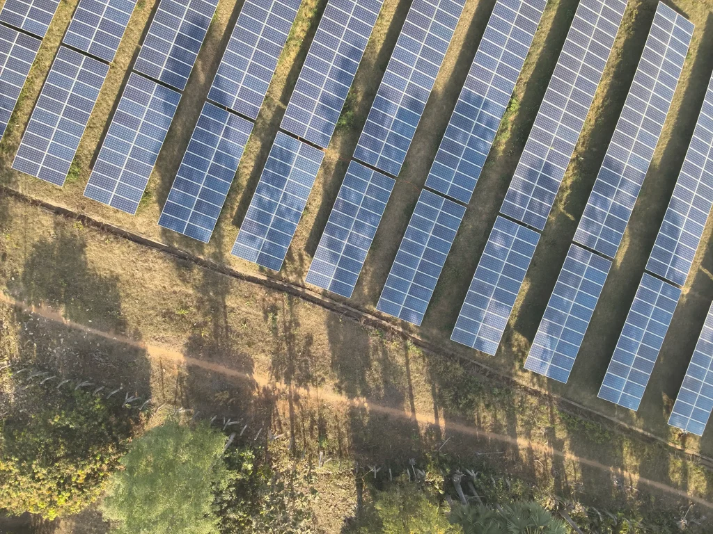 A close-up of a solar panel partially covered by a shadow, highlighting the areas where sunlight is blocked and electricity generation is reduced.