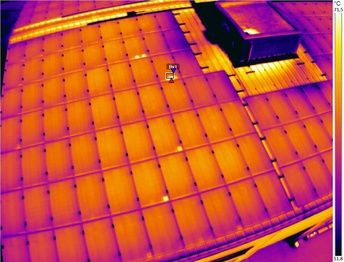 Infrared thermographic image of solar panels showing heat distribution and hot spots.