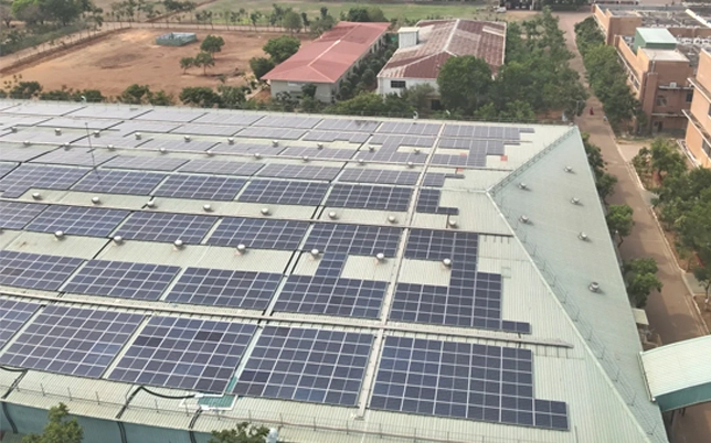 Aerial photos and videos of solar rooftop panels installed on a modern building