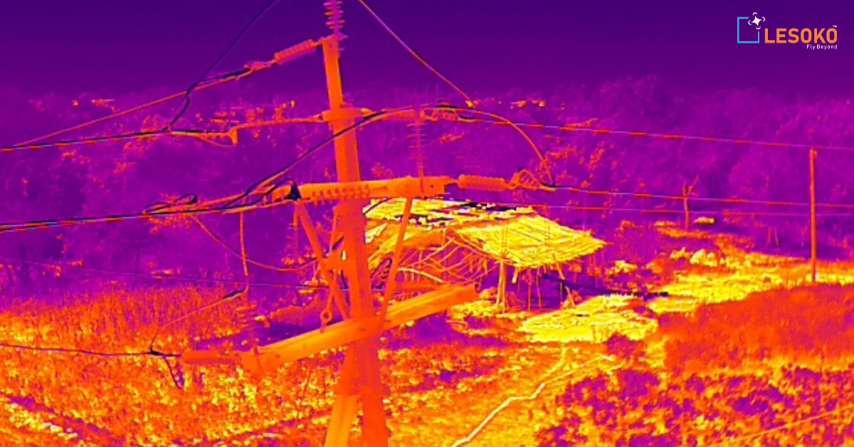 Thermal imaging camera checking high voltage transmission lines for hot spots and faults