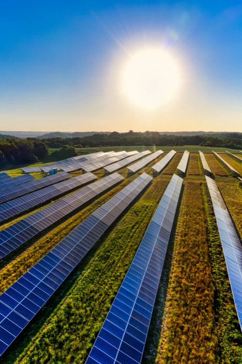 Drone equipped with thermal camera inspecting solar panels at a solar farm in India