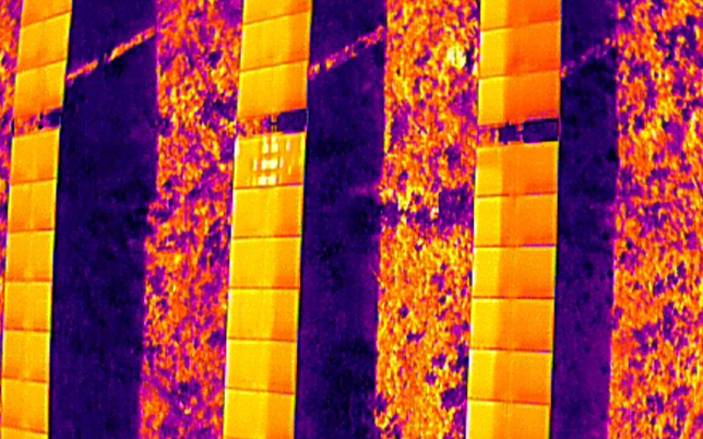 Multiple hotspots detected across a solar panel by drone thermal inspection indicating severe cell degradation