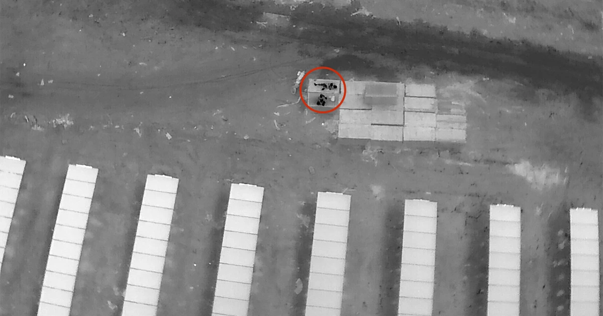 Drone night surveillance footage detecting unauthorized persons on solar panel installation site — Lesoko Technologies