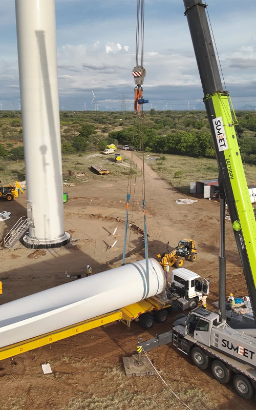 Aerial drone view of wind turbine tower erection and nacelle installation — Wind Farm Project Monitoring Services