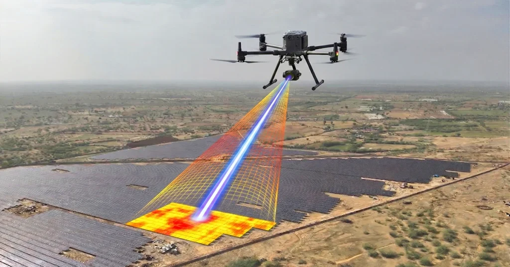 Drone performing thermal inspection over a utility-scale solar energy plant in India, detecting hotspots and panel faults