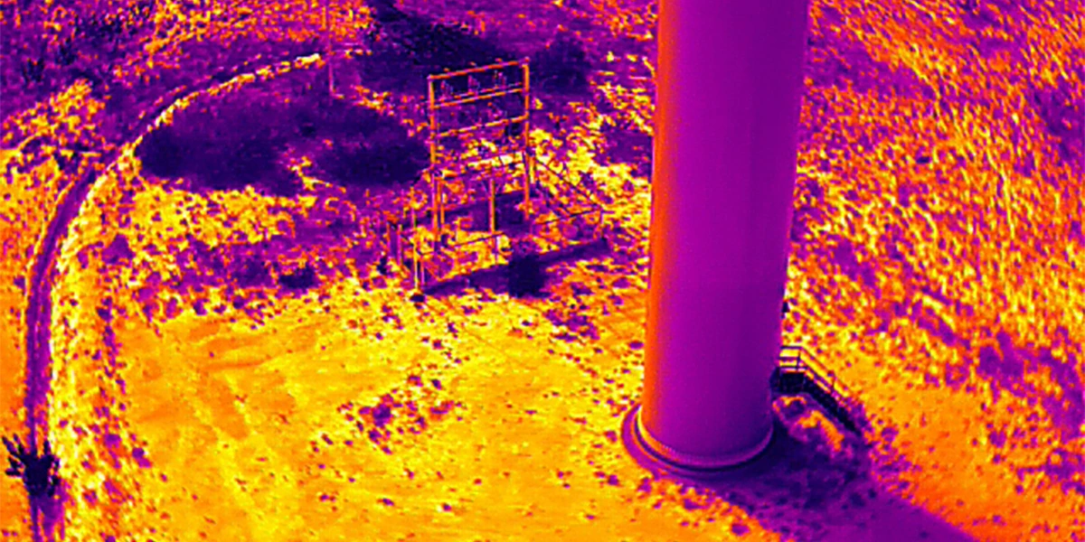 Thermal infrared drone image of wind turbine tower base showing heat signature data for structural inspection in India