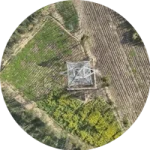 Top view drone inspection of transmission tower in agricultural corridor India