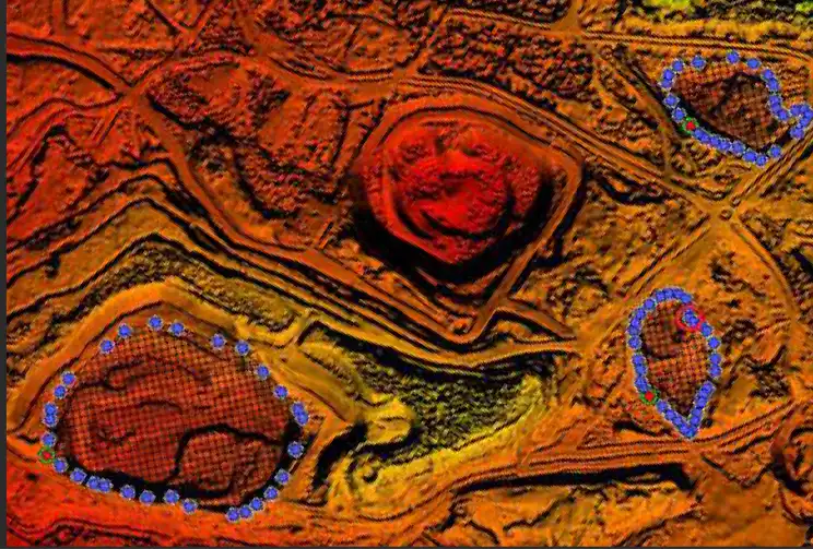 False-colour DEM showing elevated terrain mounds with blue circular boundary markers for ground mount solar site survey