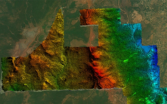 False-colour DEM showing terrain elevation gradient from red-orange high ground to green-blue lower terrain across solar survey site