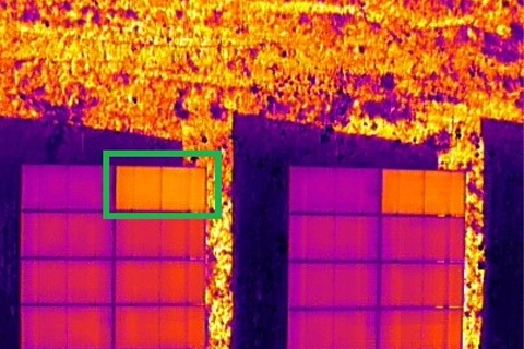 Thermal image with annotated hotspot flagged on solar module during inspection