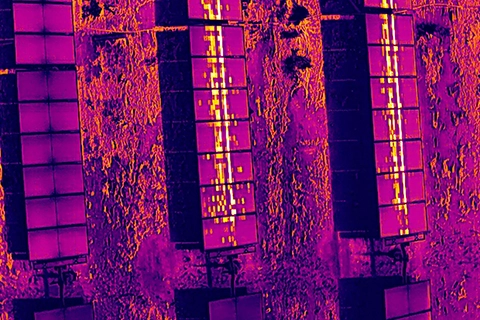 Thermal image showing irregular patchwork heat pattern on solar module consistent with PID